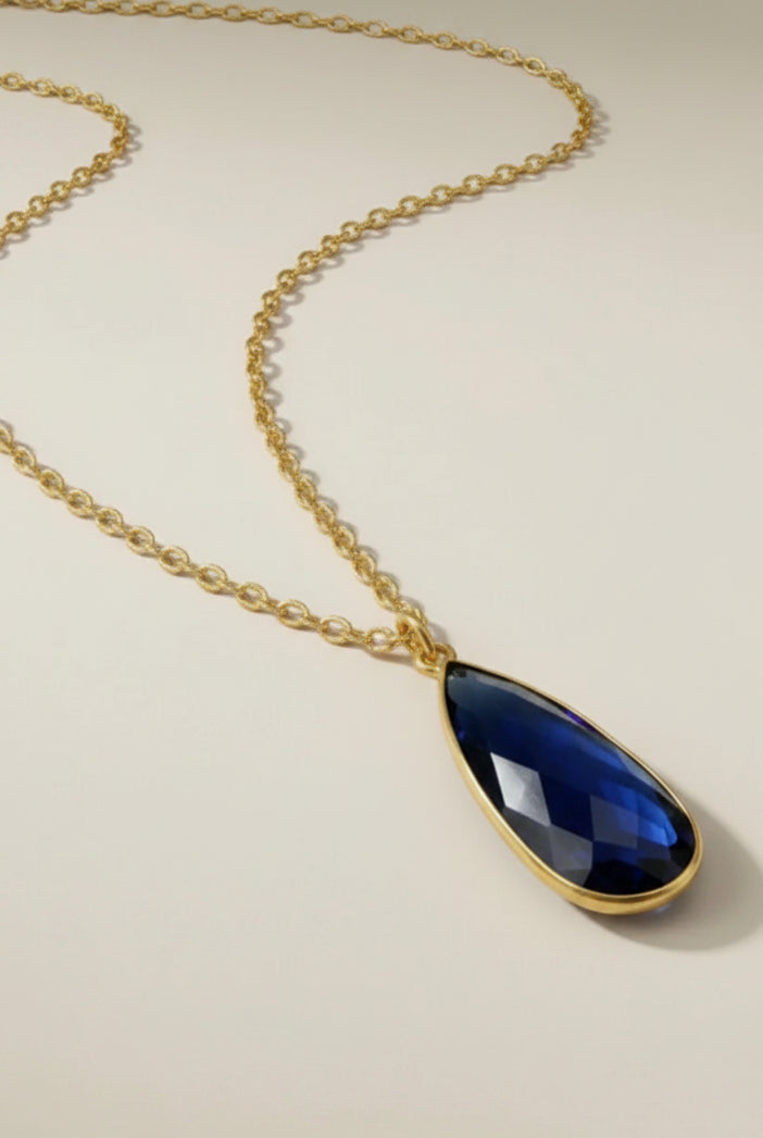 Aurea Statement Necklace with our matching Aurea Statement Ring and Aurea Drop Earrings in midnight blue