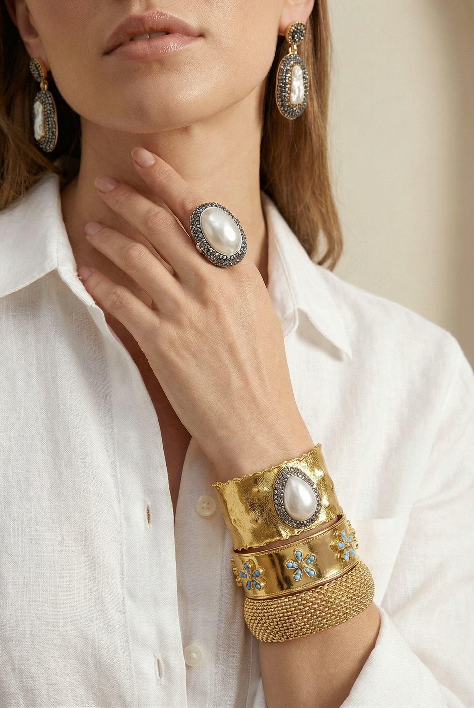 The Emerald Bloom Cuff displayed alongside the matching statement ring, showcasing the complete botanical jewelry set.
