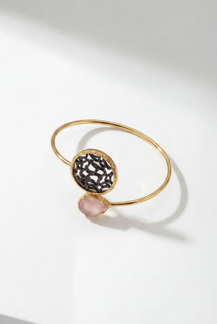 Emilia Merz Lumina Drop Cuff in Peach featuring a teardrop crystal and sculptural gold filigree centerpiece.