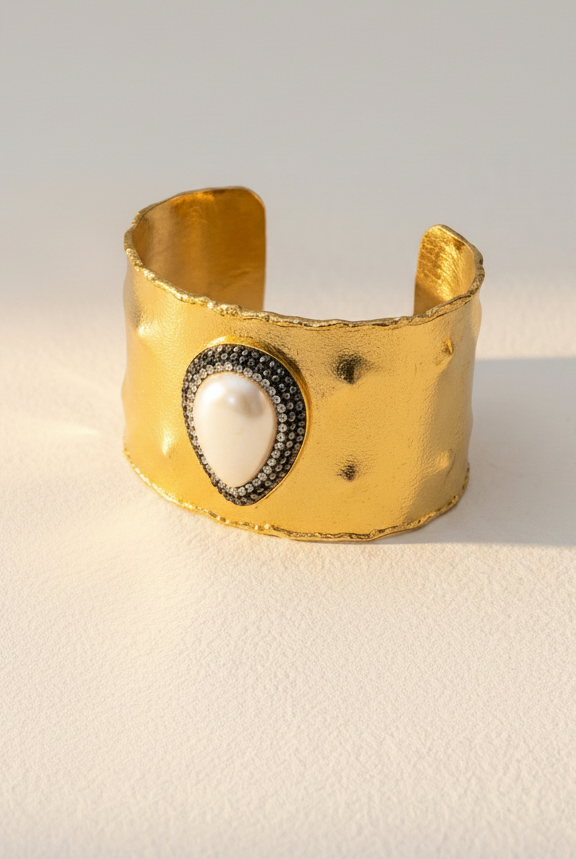 Emilia Merz Pearl Aura Cuff featuring an 18K gold-plated brass finish with a central freshwater pearl and crystal halo.
