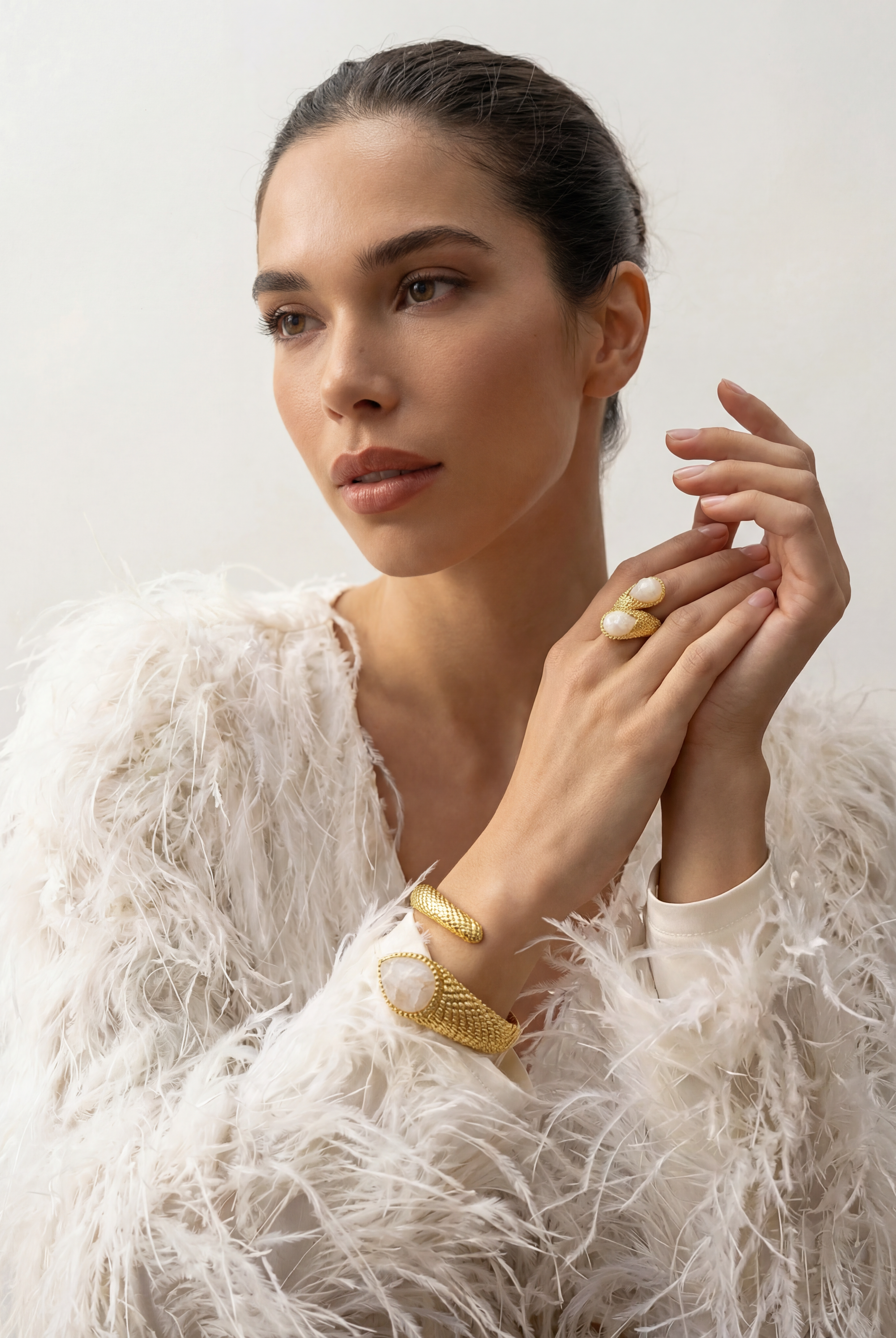 The complete Serpenté Lumina collection on a model, showcasing the matching ring and cuff bracelet.