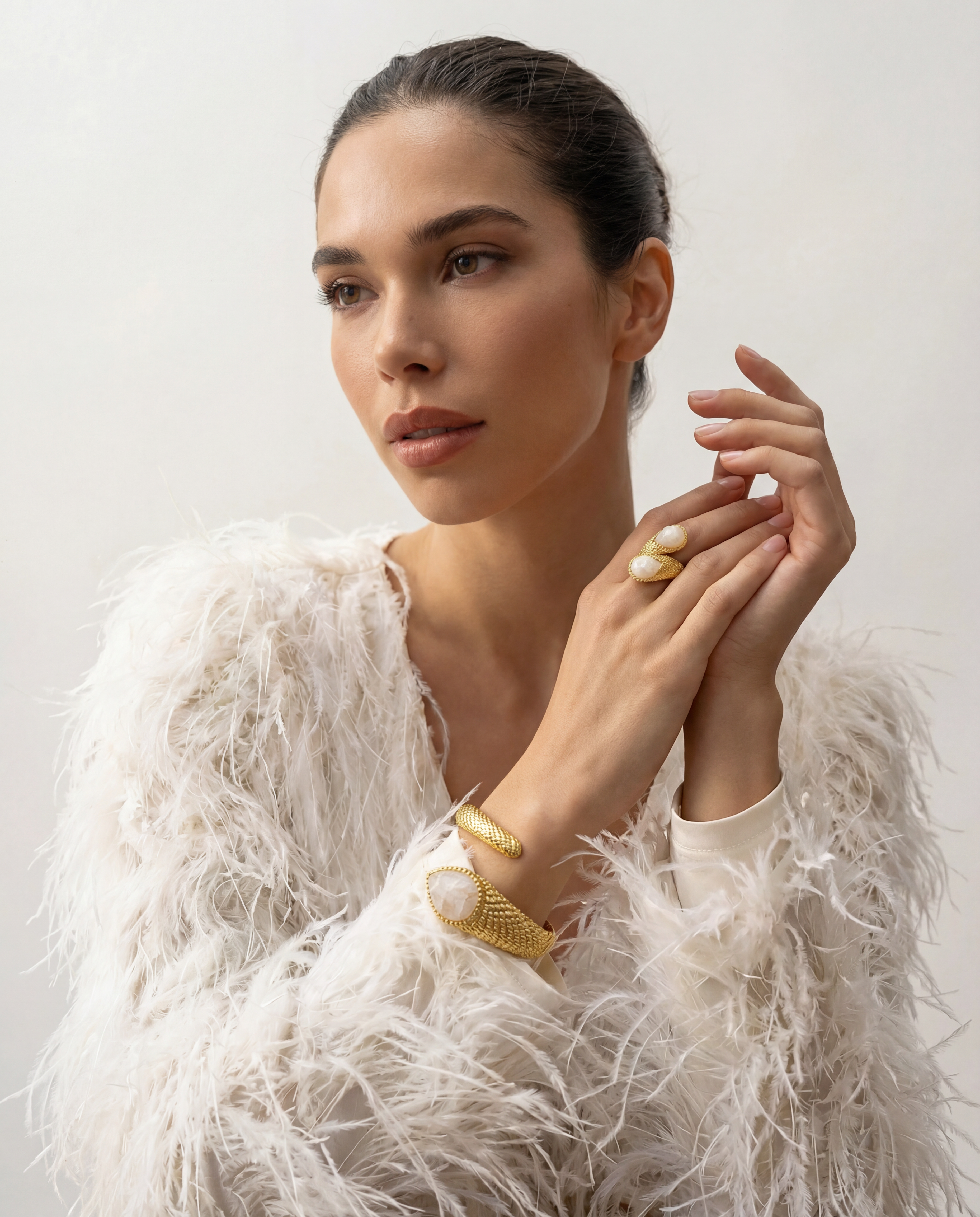 The complete Serpenté Lumina collection on a model, showcasing the matching ring and cuff bracelet.