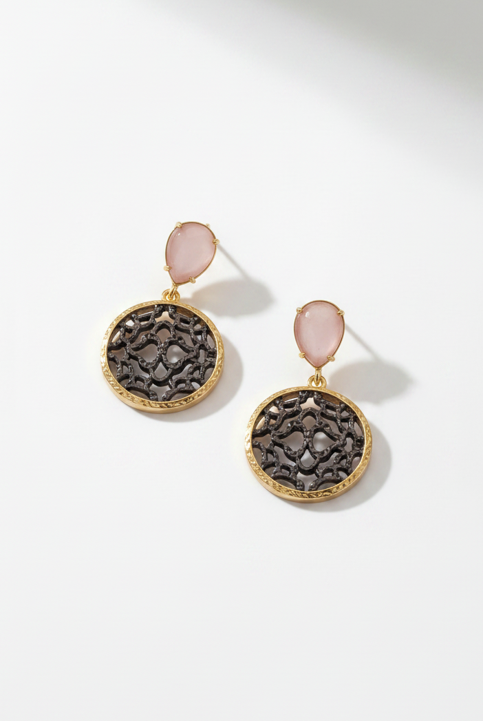 Emilia Merz Lumina Drop Earrings featuring rose-colored teardrop crystals and gold filigree discs.