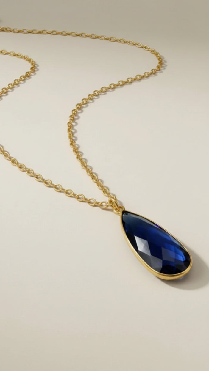 Aurea Statement Necklace with our matching Aurea Statement Ring and Aurea Drop Earrings in midnight blue