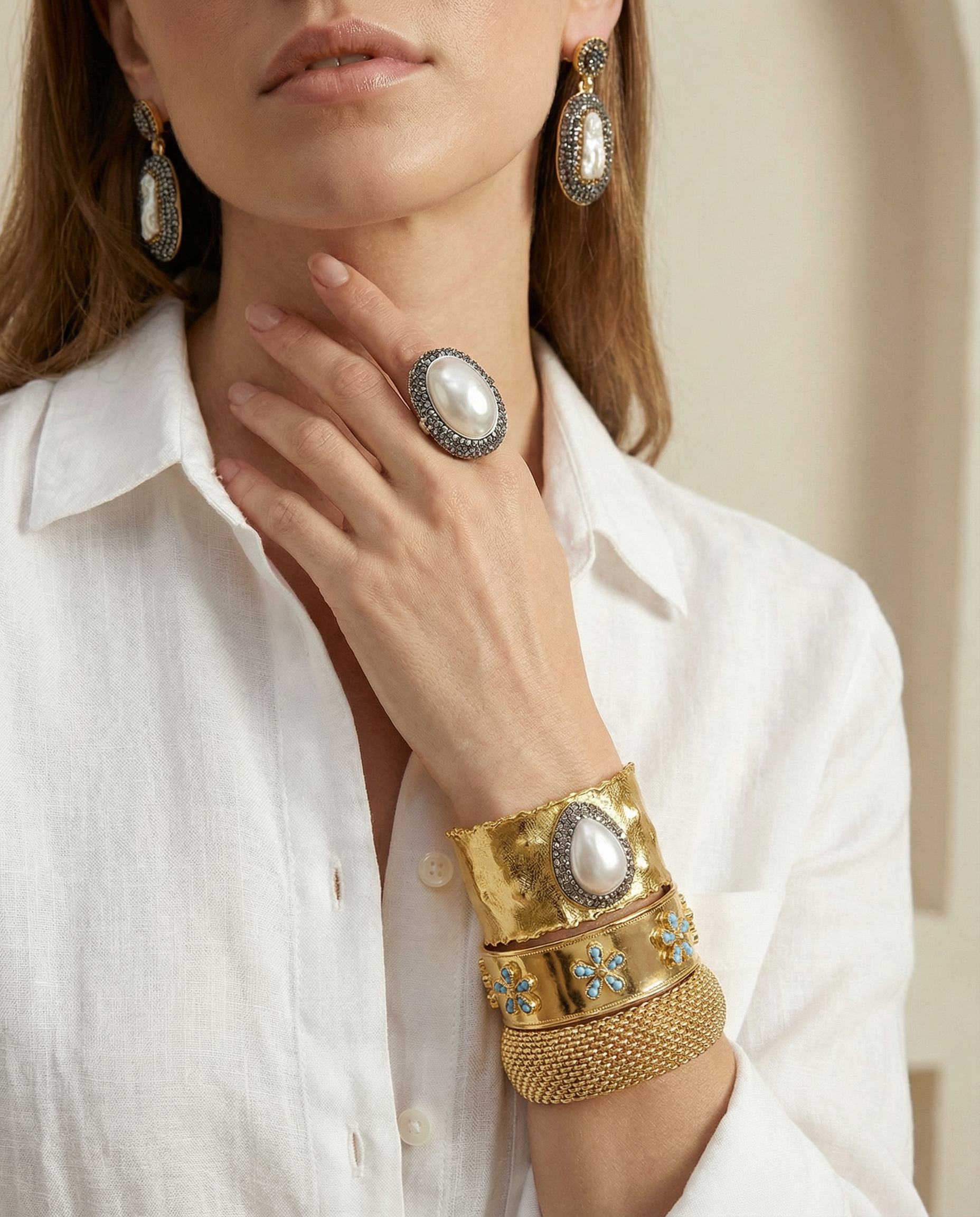 The Emerald Bloom Cuff displayed alongside the matching statement ring, showcasing the complete botanical jewelry set.