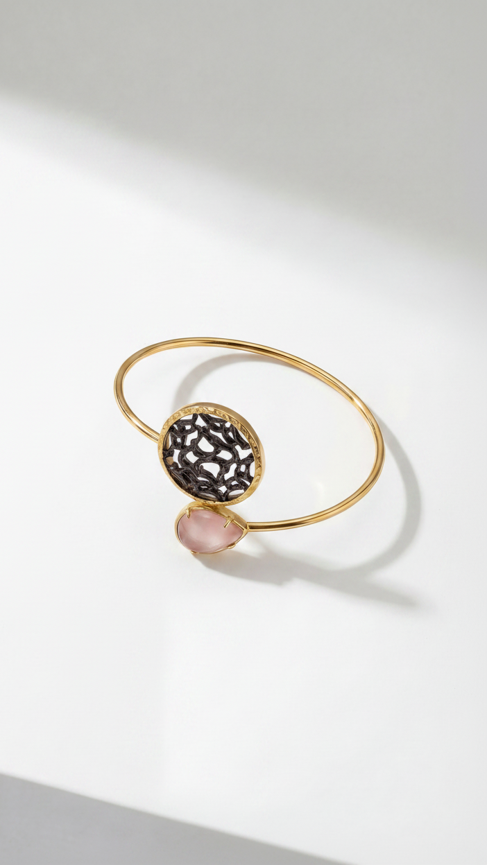 Emilia Merz Lumina Drop Cuff in Peach featuring a teardrop crystal and sculptural gold filigree centerpiece.