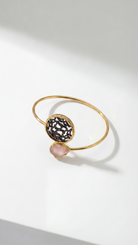 Emilia Merz Lumina Drop Cuff in Peach featuring a teardrop crystal and sculptural gold filigree centerpiece.