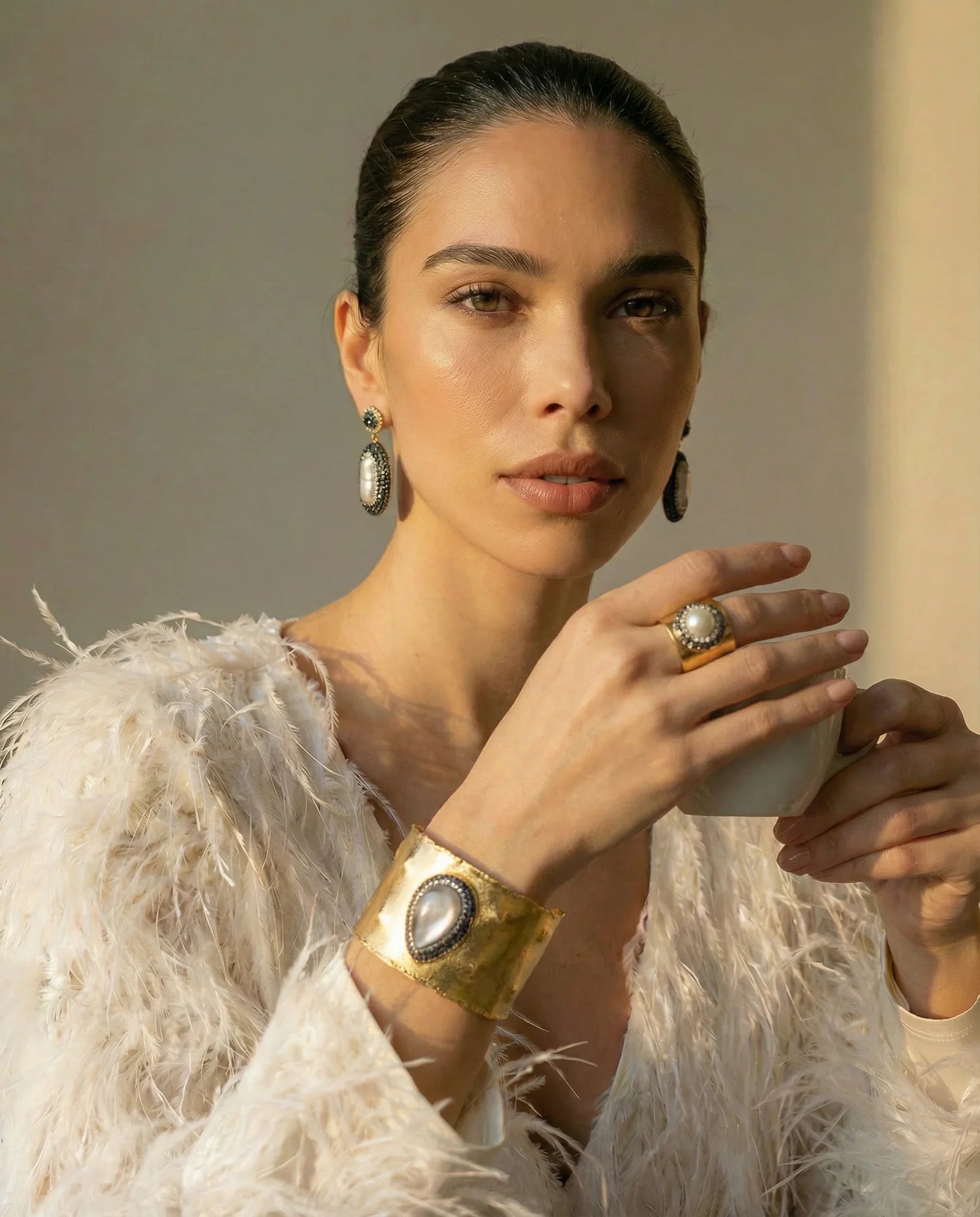 The Midnight Pearl Ring displayed with the matching Pearl Aura Cuff and statement earrings.
