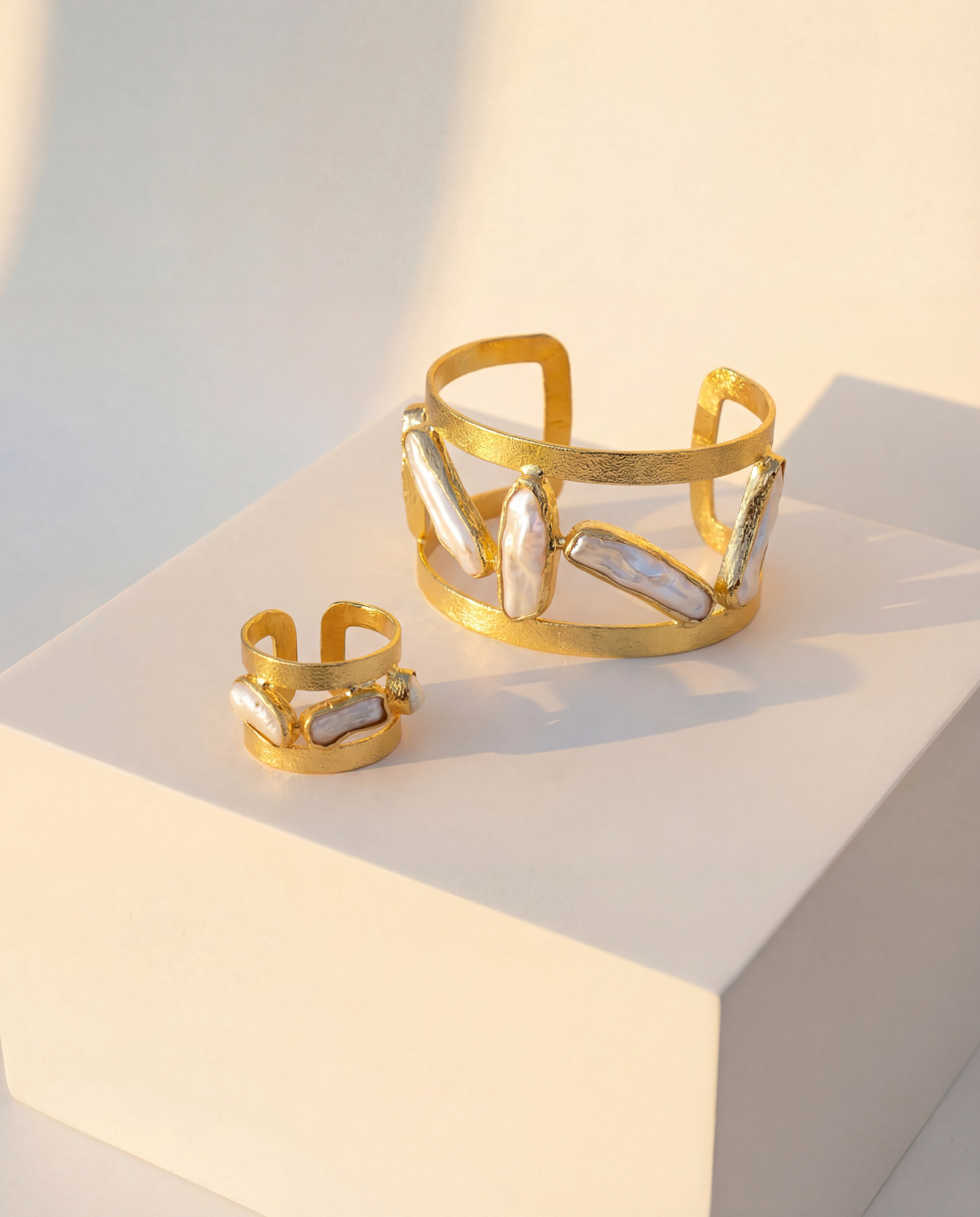 Close-up of the Oceana Pearl Ring and Cuff, highlighting the organic pearl shapes and textured gold finish.