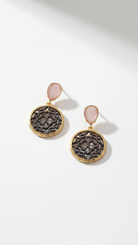 Emilia Merz Lumina Drop Earrings featuring rose-colored teardrop crystals and gold filigree discs.