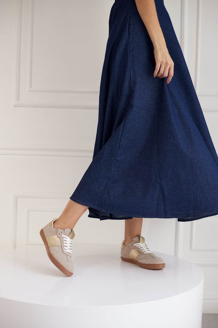 Women wearing Sky Runner beige sneakers with blue dress, German Army Trainer style
